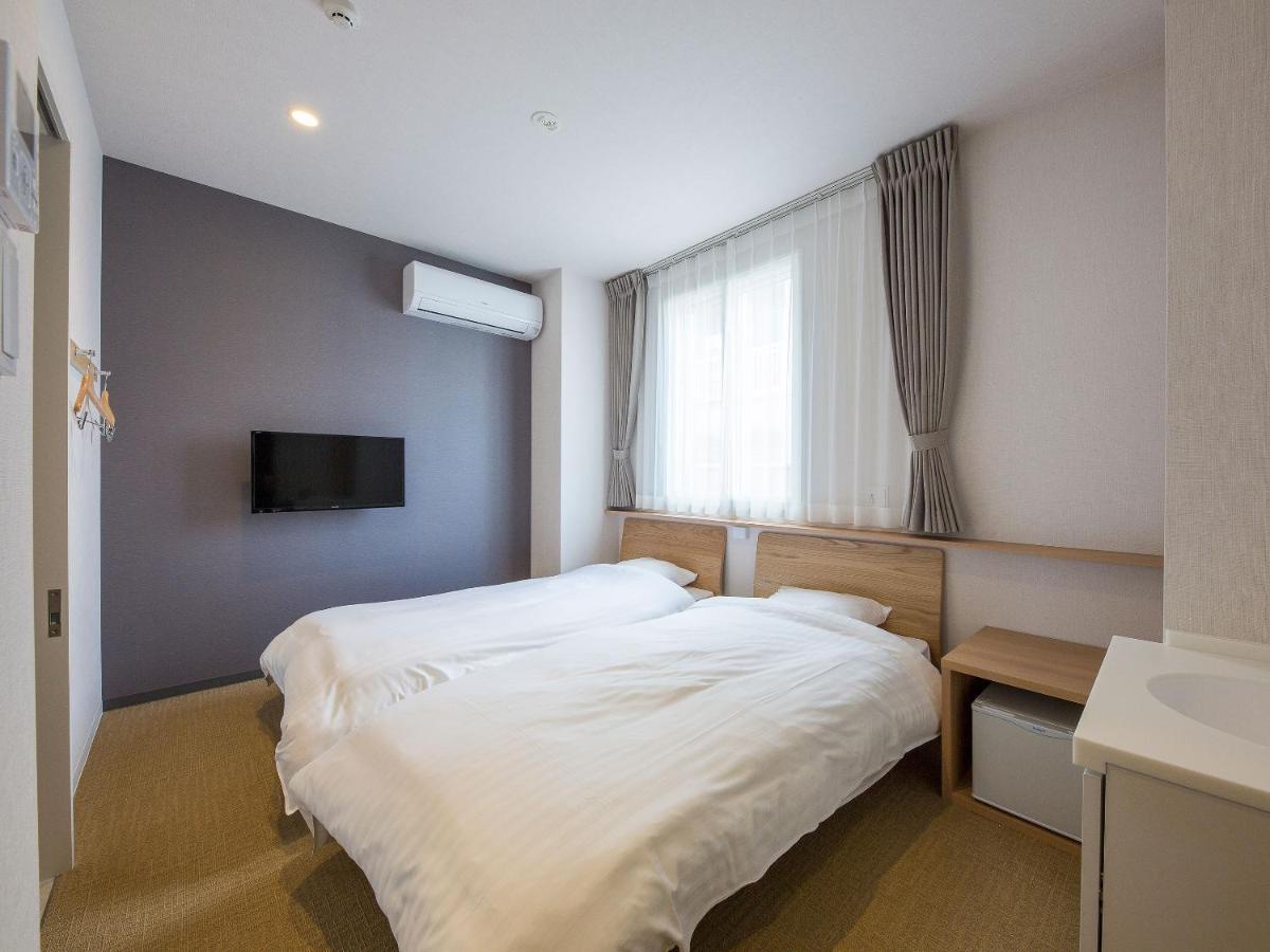 Hotel Plus Hostel Sapporo Bagian luar foto